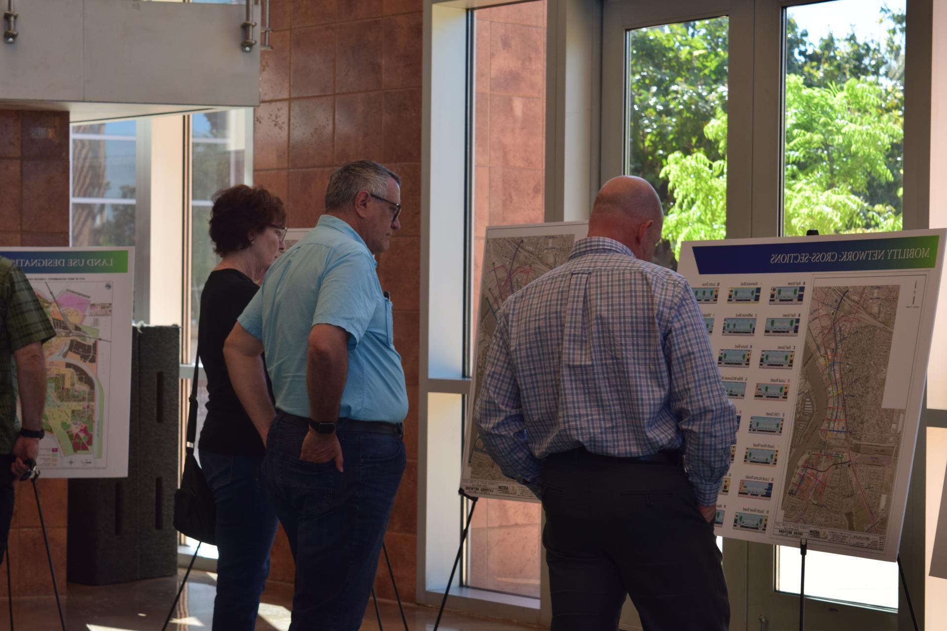 pioneer bluff open house residents read poster boards